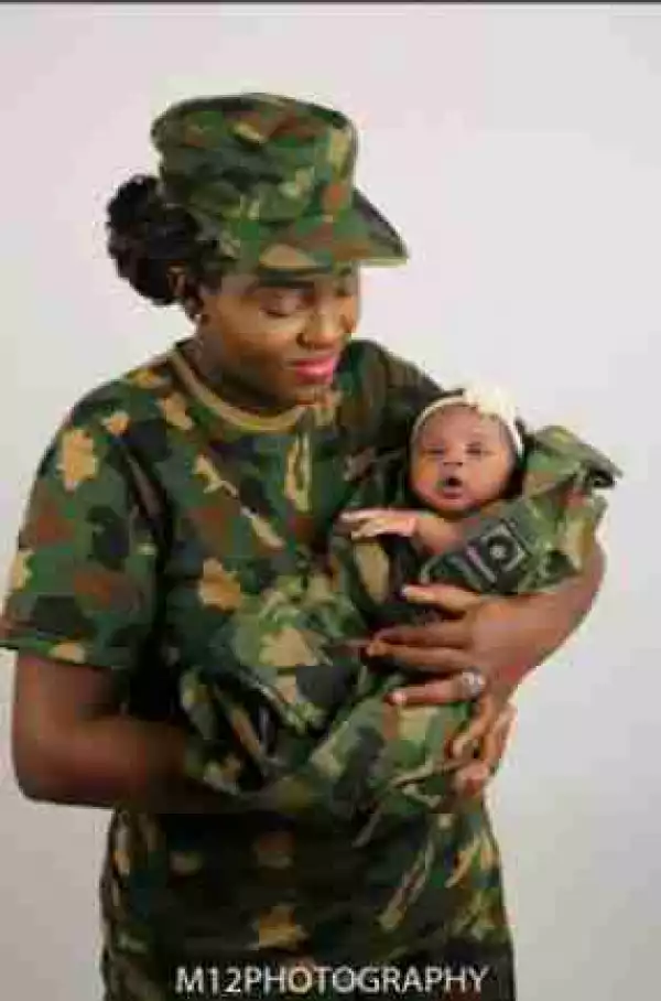 Rare And Viral Photo Of A Nigerian Female Soldier Cradling Her Newborn Baby